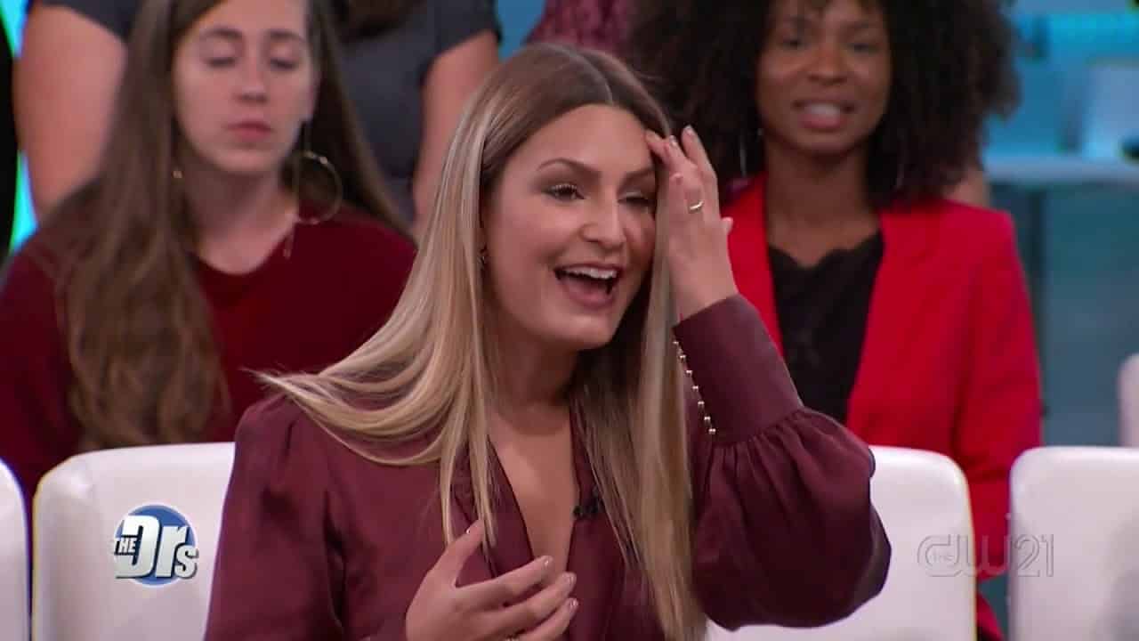 Host laughing during a segment on The Doctors TV show