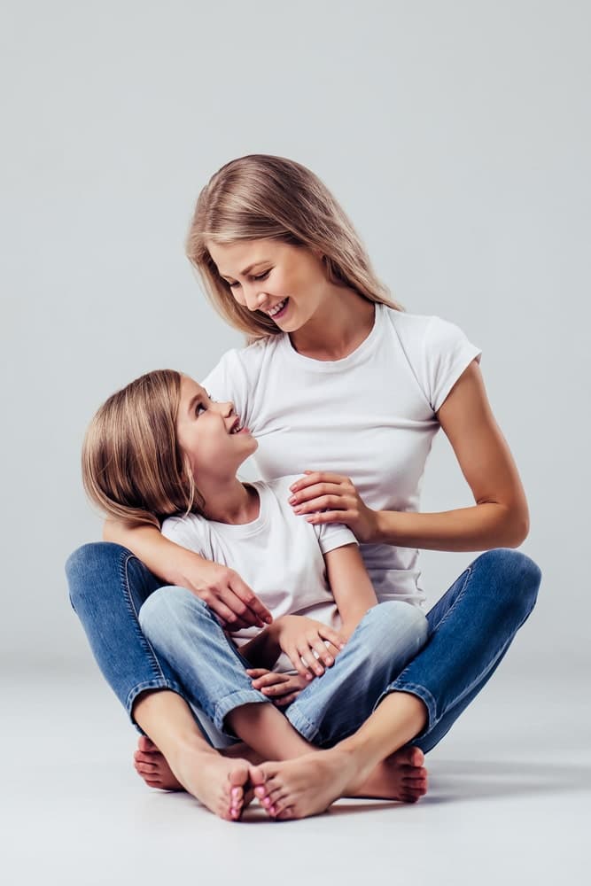 Mother and daughter sitting together